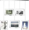 A collage of five framed pictures hanging from a rail, showcasing different scenes. Podgląd zdjęcia produktu