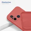 A close-up view of a red silicone phone case, showing the camera cutout and the interior texture. Produktbild-Vorschau