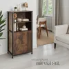 A wooden highboard with black metal accents is shown in a room setting, next to a sofa and dining chairs. Produktbild-Vorschau