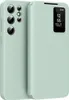 A light green flip case for a smartphone is shown from the front and side. Náhled obrázku produktu