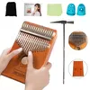 A collage of images showing a Kalimba instrument, its accessories, and a person playing it. Produktbild-Vorschau