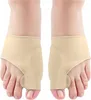 A pair of beige bunion corrector sleeves are shown on a person's feet. Voir les images du produit
