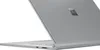 A close-up, angled view of a silver Microsoft Surface Book 3 laptop, showing the back of the screen and part of the keyboard. Produktbild-Vorschau