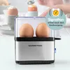 A GOURMETmaxx egg cooker with two eggs inside, shown in a studio setting with a blurred background of other egg cups. Produktbild-Vorschau