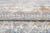 A close-up view of a folded rug with a distressed pattern. Anteprima dell’immagine prodotto