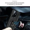 A person's hand is holding a black phone case with a ring holder, which is magnetically attached to a rose gold car mount. The scene is set inside a car. Produktbild-Vorschau