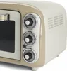 Close-up view of the control panel and side of a cream-colored retro-style mini oven. Anteprima dell’immagine prodotto