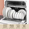 A dishwasher filled with white plates and bowls with black rims. Produktbild-Vorschau