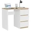 A white and wood desk with a laptop, picture frame, and lamp on it.
