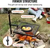 People are camping and cooking over a campfire using a grill. Náhled obrázku produktu