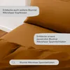 A close-up view of a brown bed sheet and pillow, with text overlays highlighting product features and encouraging further exploration. Náhled obrázku produktu