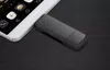 A white smartphone is placed on a black surface, with a black USB-C adapter plugged into its side. Produktbild-Vorschau