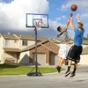 Two young men playing basketball in a residential driveway. Produktbild-Vorschau