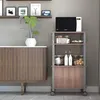 A microwave cart with a microwave on top and storage below, next to a cabinet. Podgląd zdjęcia produktu
