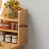 A close-up of a wooden shelf unit containing skincare products and a vase of sunflowers. Podgląd zdjęcia produktu
