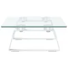 A white metal and glass monitor stand is shown against a white background. Náhled obrázku produktu