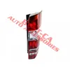 A rear car light assembly on a white background with a red overlay. Voir les images du produit