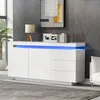 A modern white sideboard with blue LED lighting, decorated with a lamp and books, in a living room setting. Anteprima dell’immagine prodotto