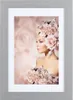 A woman adorned with flowers, presented in a framed image. Produktbild-Vorschau