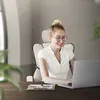 A woman is working on a laptop while sitting in an ergonomic office chair. Produktbild-Vorschau