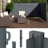 A patio scene with outdoor furniture and a retractable side awning. Anteprima dell’immagine prodotto