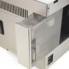 A close-up view of the side of a coffee machine, focusing on the removable water tank. Produktbild-Vorschau