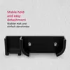 A black wall mount with text overlay describing its features. Produktbild-Vorschau