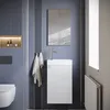 A modern bathroom vanity with a sink and cabinet, set against a blue wall with decorative vertical panels. Voir les images du produit