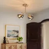 A hallway with a wooden door and a cabinet with a painting and flowers. Produktbild-Vorschau