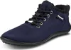 A single navy blue shoe with black laces and black trim is shown against a white background. Produktbild-Vorschau