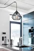 A modern kitchen with a pendant light hanging over a countertop with appliances. Produktbild-Vorschau