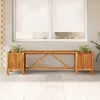 A wooden bench with two attached planters sits on a tiled patio in front of a window with white blinds. Produktbild-Vorschau