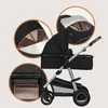 A collage of images showcasing a black and silver baby stroller with close-up views of its features. Produktbild-Vorschau