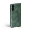 A green flip cover phone case is shown against a white background. Produktbild-Vorschau
