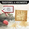 Christmas decorations, specifically straw stars, are displayed with festive greenery and a red ornament. Produktbild-Vorschau