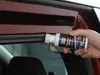 A hand is holding a bottle of Liqui Moly Gummipflege and applying it to a rubber seal on a car door. Anteprima dell’immagine prodotto