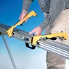 A person is using yellow accessories on a metal stand. Produktbild-Vorschau