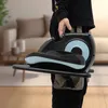 A person is holding a portable elliptical machine in a living room setting. Podgląd zdjęcia produktu