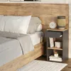 A bedroom scene with a bed and a nightstand. Náhled obrázku produktu