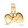 A pair of gold heart-shaped charms with inscriptions. Produktbild-Vorschau