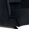 A close-up view of the dark blue fabric of a chair, showing the stitching and texture. Produktbild-Vorschau