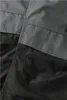 A close-up view of two pieces of fabric, one gray and one black, stitched together. Anteprima dell’immagine prodotto