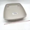 A light gray cat litter box is shown from a slightly elevated angle on a white background. A measuring tape is placed in front of the litter box. Produktbild-Vorschau
