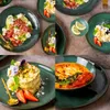 A collage of four images showcasing different dishes served on green stoneware plates, including a salad, a dessert, and a soup. The dishes are garnished with flowers, fruits, and herbs. Náhľad obrázku produktu