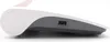 Side view of a white and gray router with a pink accent on top. Produktbild-Vorschau
