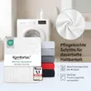 Product packaging and stacked sheets of bedding in a laundry room setting. Produktbild-Vorschau