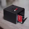 A black NAS device with a red WD Red hard drive inserted. Náhľad obrázku produktu