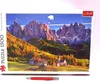 A puzzle box featuring a scenic mountain landscape with a village and autumn foliage. Voir les images du produit