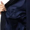 A close-up view of the inside of a dark blue jacket, showing the zipper and lining. Produktbild-Vorschau