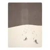 Two skiers descending a snowy slope under a dark sky. Produktbild-Vorschau